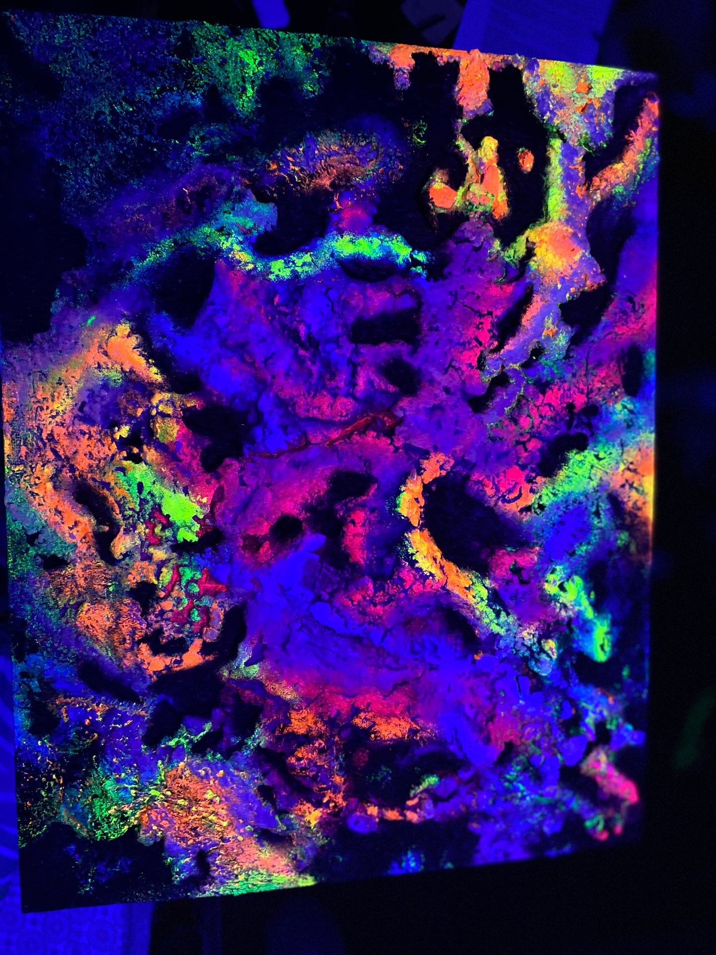 UV active Melting Galaxy neon painting glowing under blacklight – psychedelic 3D cosmic wall art with radiant neon colors by Melted Glam.