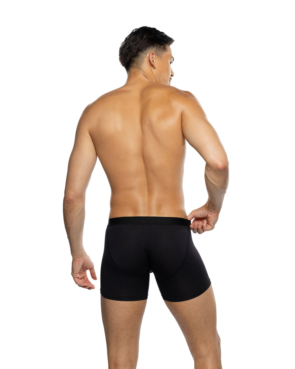 Man wearing black swim shorts on a white background