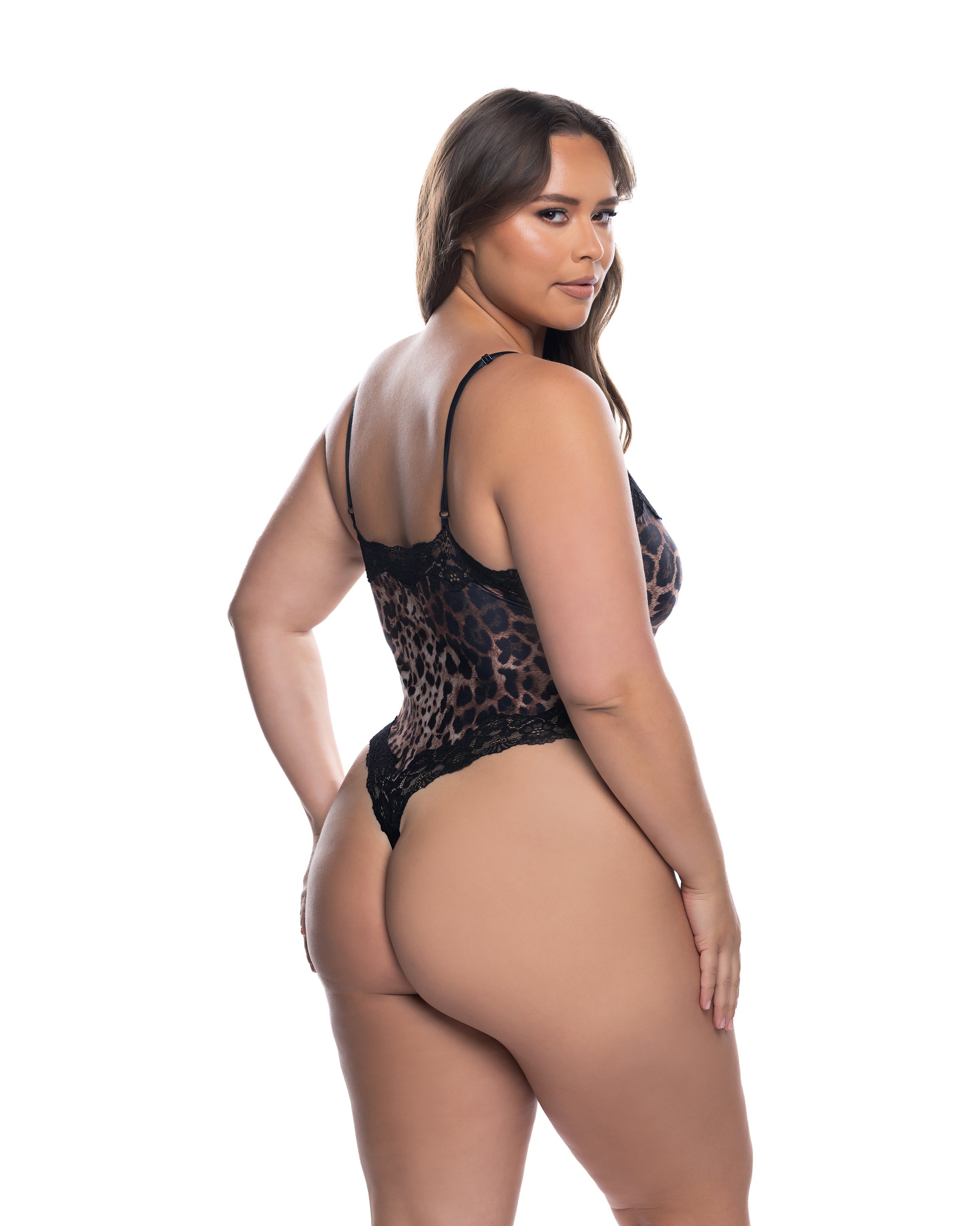 Woman wearing a leopard print lingerie set on a white background, plus size back